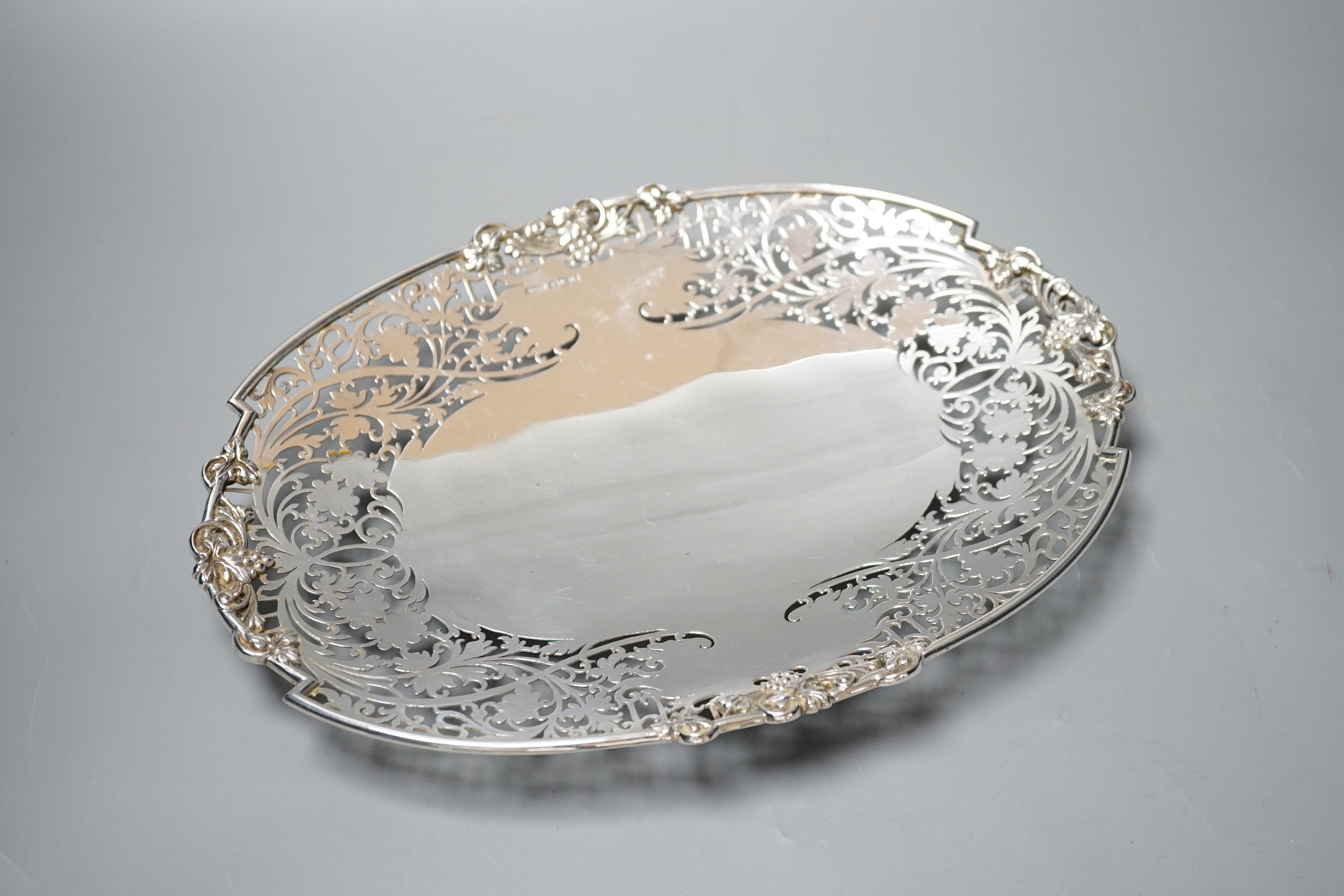 A George VI pierced silver shallow dish, Sheffield, 1948, 30cm, 19oz.